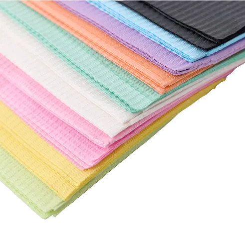 Stack of colorful folded cloths on a white surface